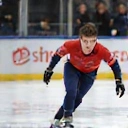 Action shot of Hiroshi Tanaka, a young male speed skater